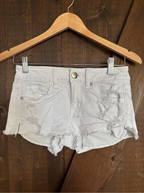 American Eagle White Distressed Shortie Denim Shorts